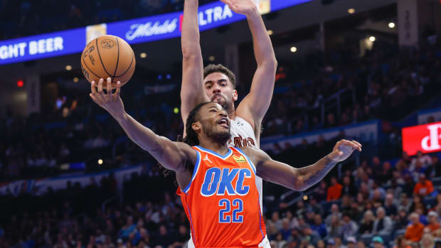 Nov 8, 2023; Oklahoma City, Oklahoma, USA; Oklahoma City Thunder guard Cason Wallace (22) shoots in front of Cleveland Cavaliers forward Georges Niang (20) during the second half at Paycom Center. Oklahoma City won 128-120. 
